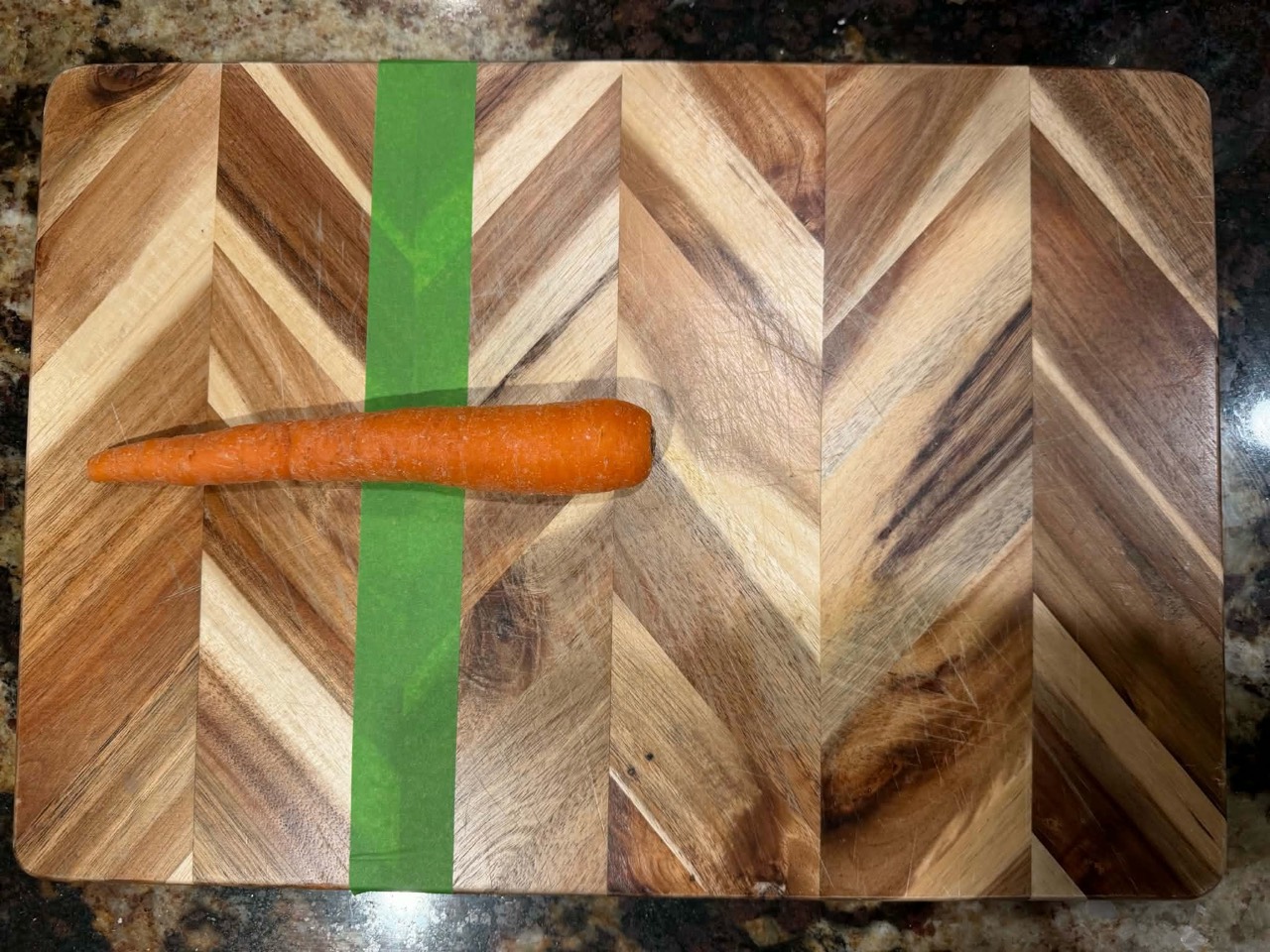 Carrot crossing green tape with no hand present